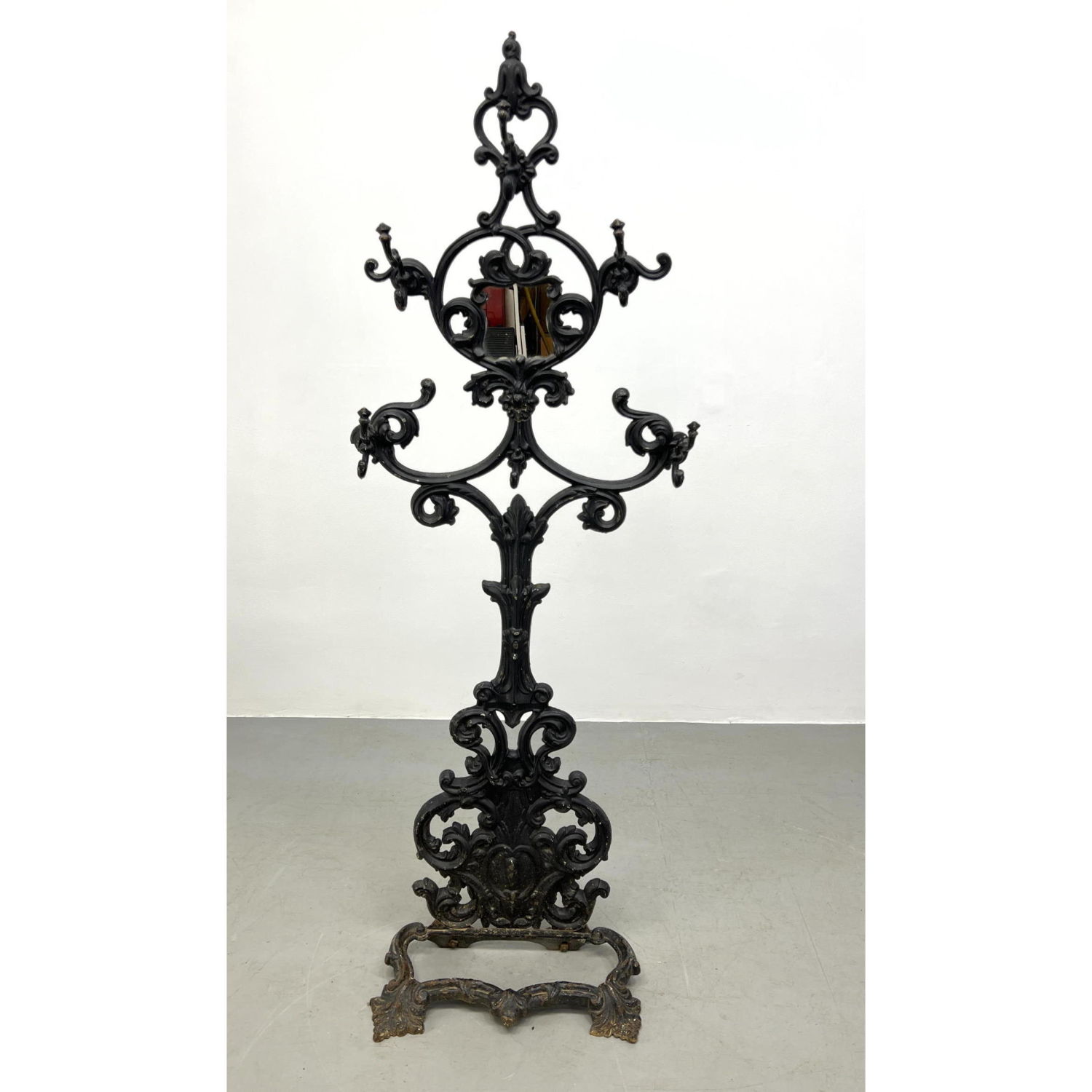 Appraisal: Black Painted Decorative Iron Standing Coat Rack Fancy metal trim