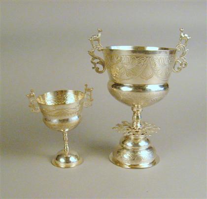 Appraisal: Two South American silver chalices probably peruvian The embossed bowls