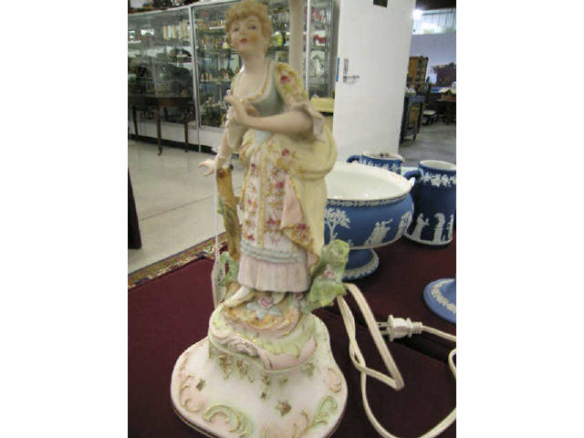 Appraisal: Pair of Figural Bisque Lamps French man woman