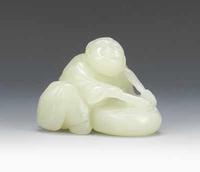 Appraisal: A Carved Jade Man with Drum The smiling figure is