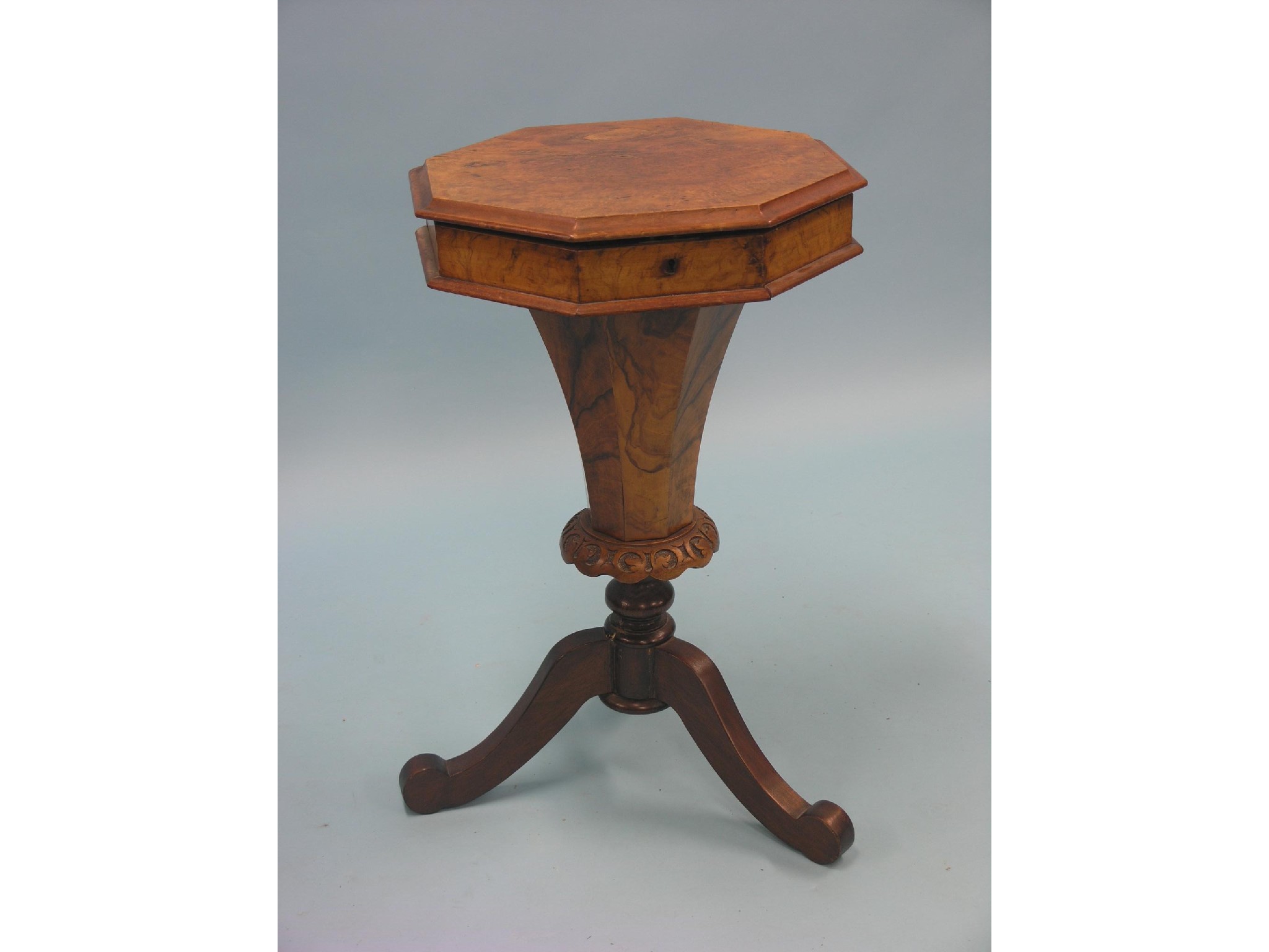 Appraisal: A Victorian burr walnut work table octagonal-shape with enclosed fittings