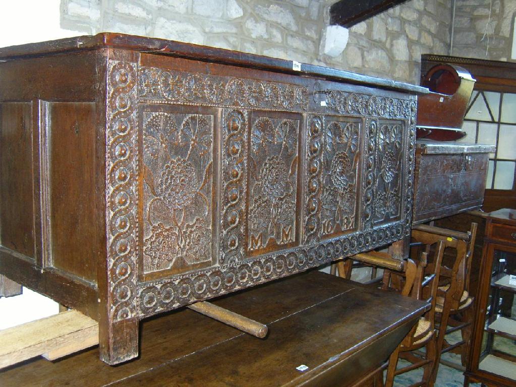 Appraisal: A good quality th century panelled oak coffer the front