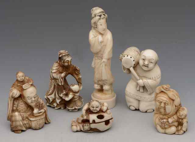 Appraisal: A COLLECTION OF SIX IVORY NETSUKES to include a standing