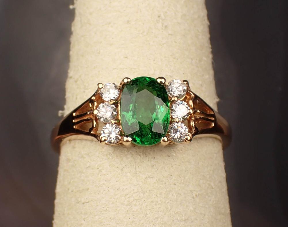 Appraisal: TSAVORITE GARNET DIAMOND AND FOURTEEN KARAT GOLD RING The yellow