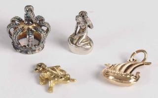 Appraisal: Group of Gold and Silver Charms ships charm tested kt