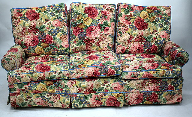 Appraisal: A THREE SEATER SOFA covered in floral material cm wide