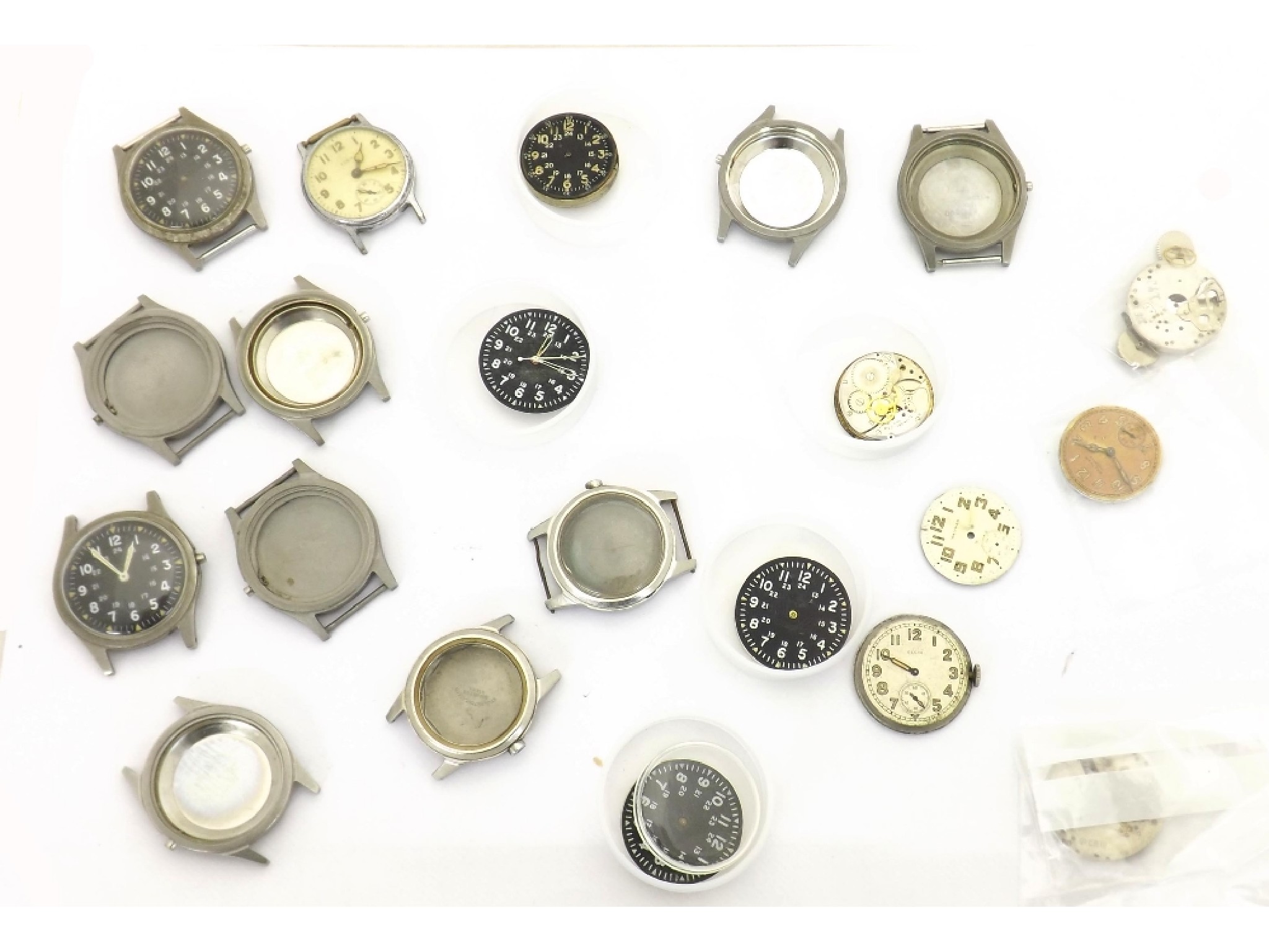 Appraisal: Collection of assorted US Military watch parts to include Elgin