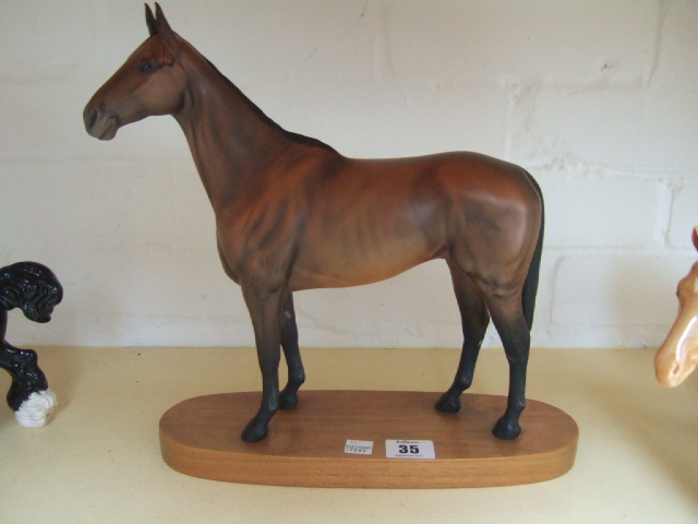 Appraisal: A Beswick horse modelled as Arkle on a stand matt