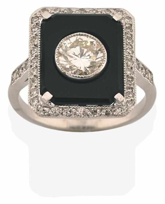 Appraisal: AN ART DECO STYLE ONYX AND DIAMOND RING The rectangular