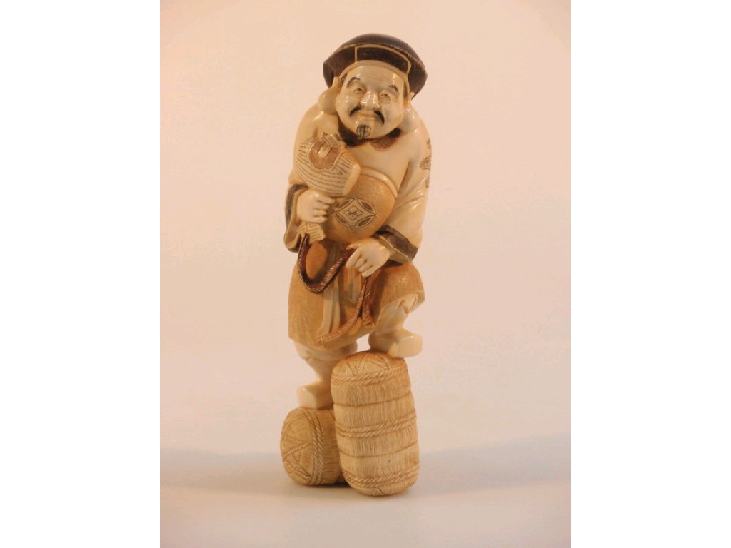 Appraisal: A Japanese Meiji period ivory figure of Hotei the smiling