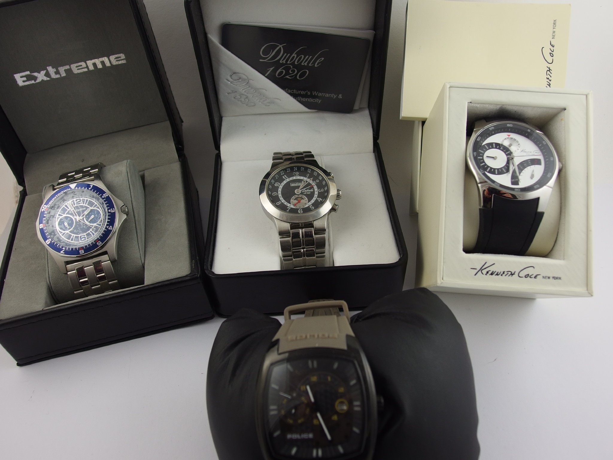 Appraisal: A collection of four gents fashion watches in original boxes