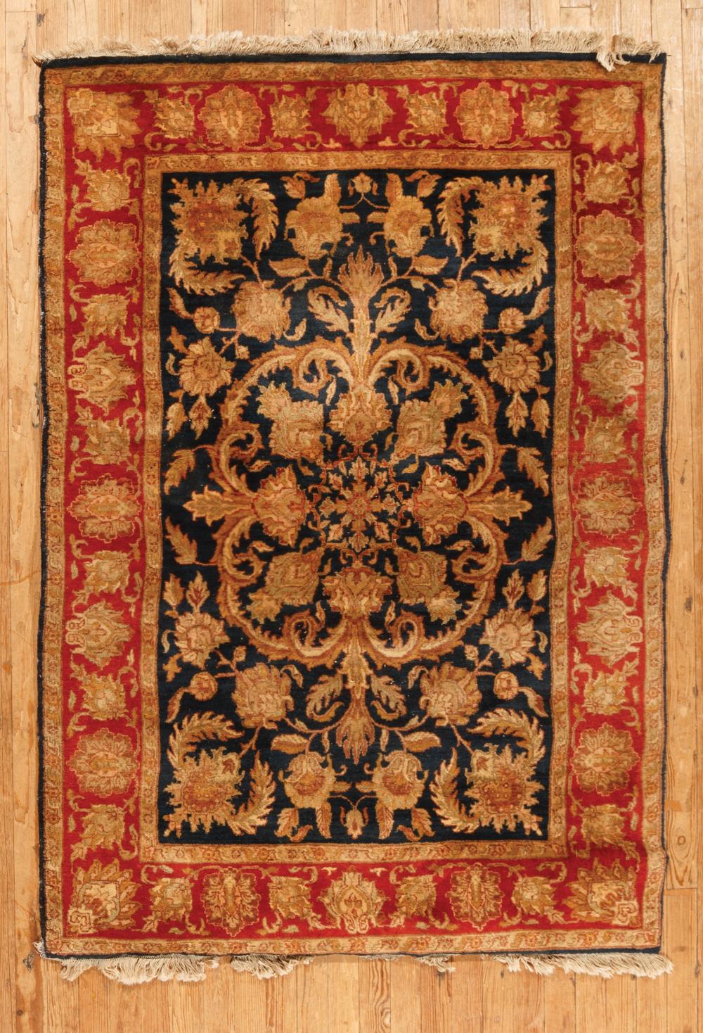 Appraisal: Small Persian Rug blue and red ground foliate design ft