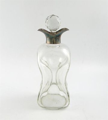 Appraisal: An Edwardian silver-mounted decanter by Heath and Middleton Birmingham hour