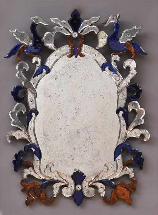 Appraisal: CONTINENTAL BAROQUE-STYLE COLORED GLASS MIRROR The antiqued cartouche-shaped plate within