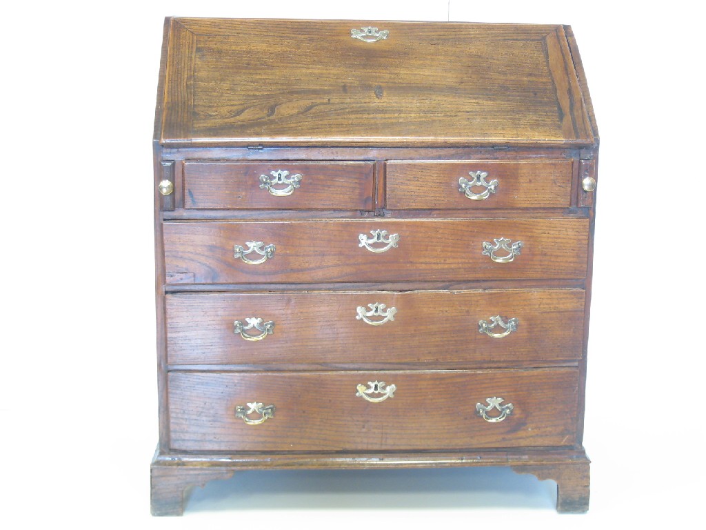 Appraisal: An antique elm Bureau with fitted interior above two short