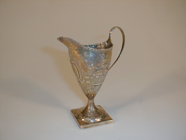 Appraisal: A George III silver helmet cream jug the body later