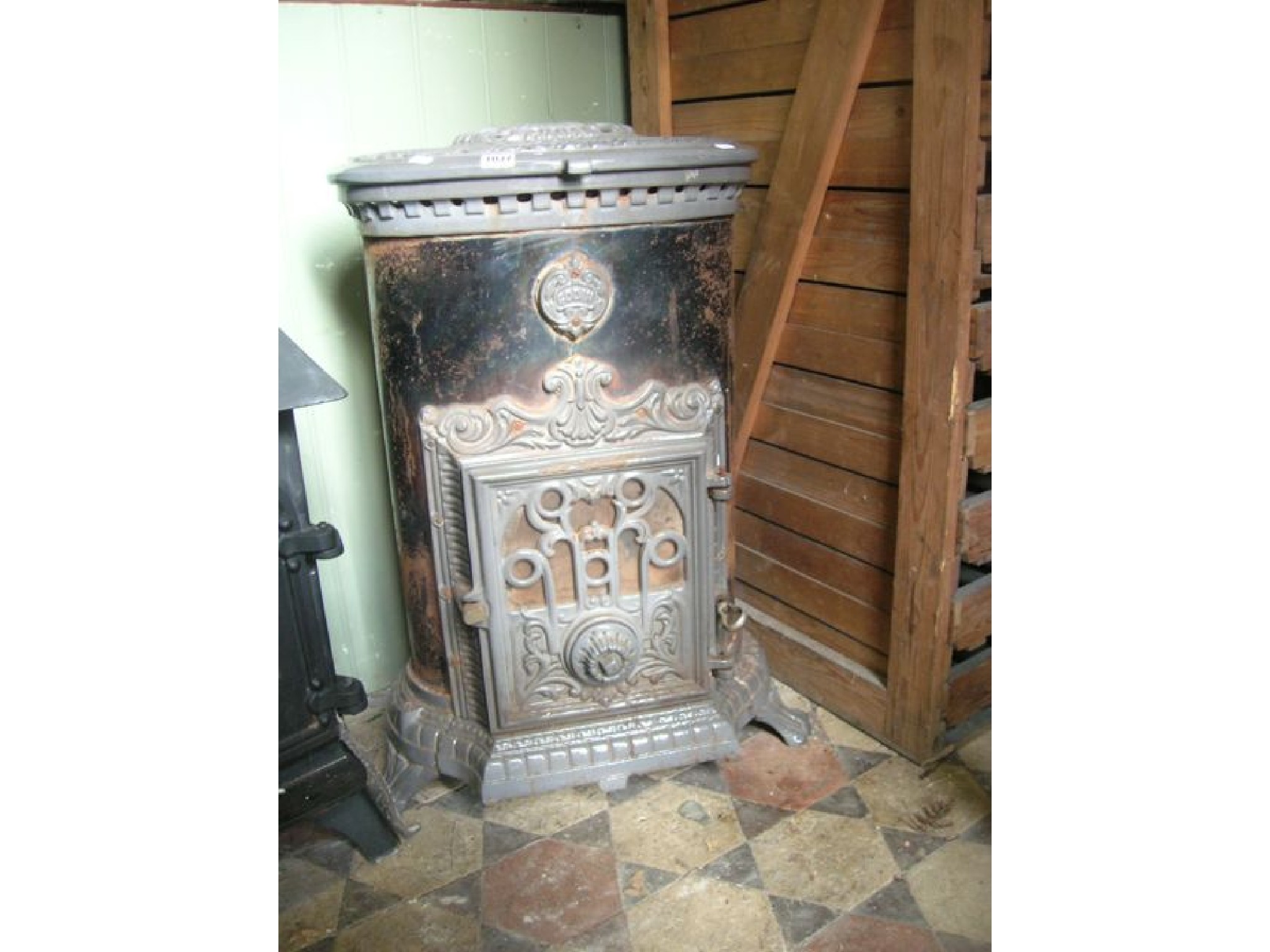 Appraisal: A Godin cast iron and enamel stove of oval form