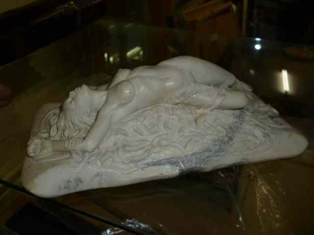 Appraisal: A RESIN FIGURE of a reclining nude stamped on the