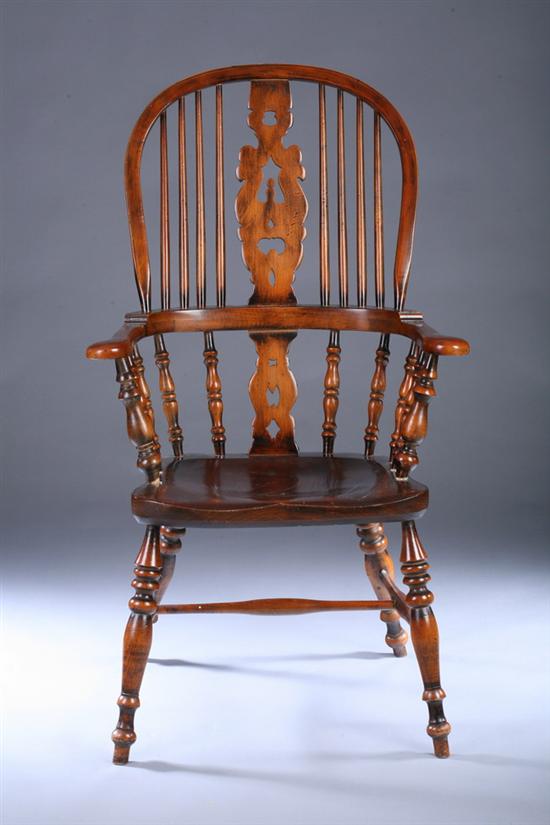 Appraisal: WINDSOR STYLE MIXED-WOOD HIGH-BACK ARM CHAIR th century Bentwood sack-back