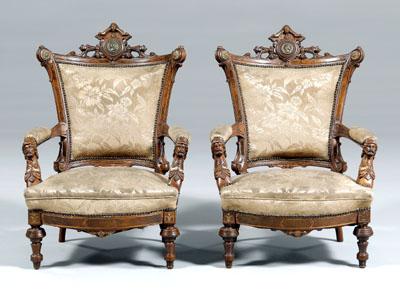 Appraisal: Pair Victorian carved open armchairs walnut neo-Greco style with figurally