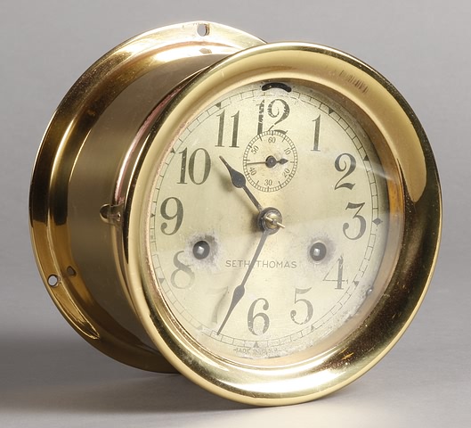 Appraisal: Circa polished brass case day ship's bell strike silver dial