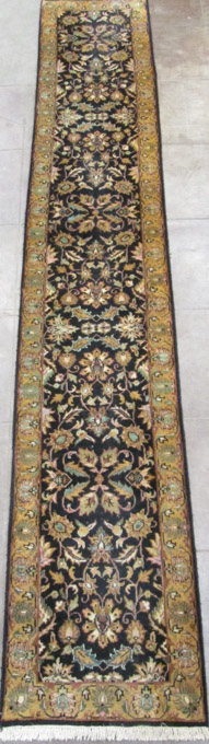 Appraisal: HAND KNOTTED ORIENTAL LONG RUG Indo-Persian overall foliate design on