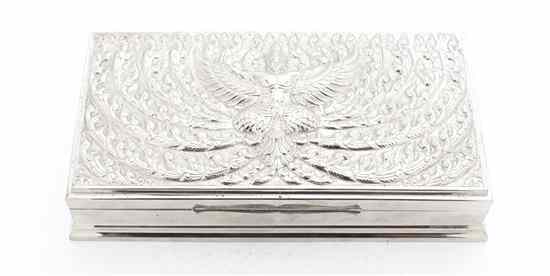 Appraisal: A Southeast Asian Silver Cigarette Box the lid with winged