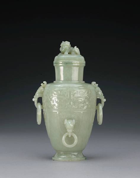 Appraisal: A pale greenish-white jade covered vase Of oval section and