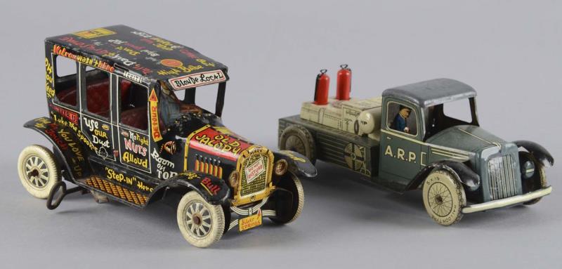 Appraisal: Lot Of Tin Litho Wind-Up Toys Including - Air Raid