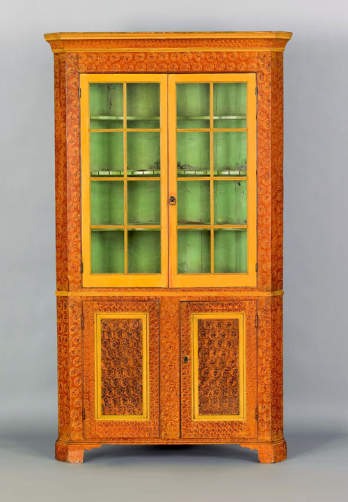 Appraisal: Pennsylvania painted two part corner cupboard early th c retaining