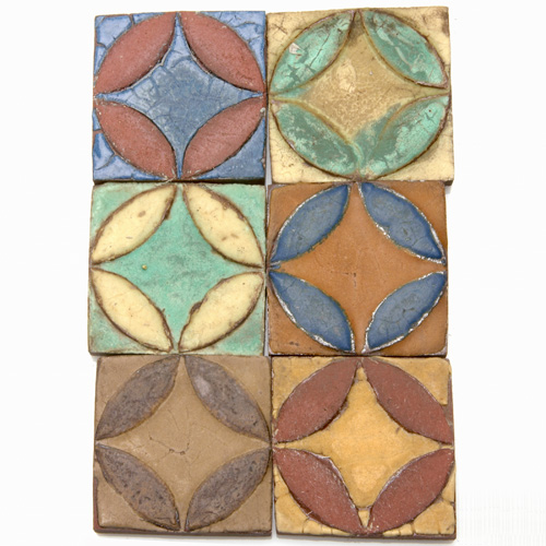 Appraisal: GRUEBY Eighty geometric tiles with raised leaf-like geometric pattern thirty-five