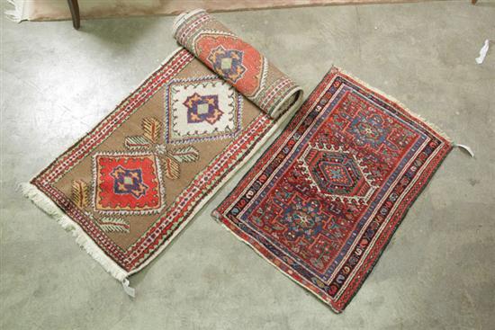 Appraisal: TWO ORIENTAL RUGS Persian mat having repeating hooked medallions with