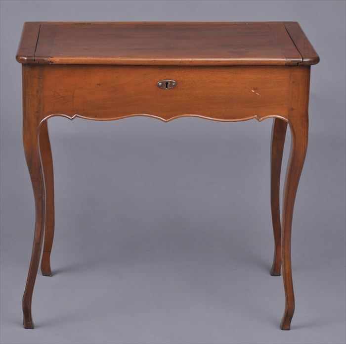 Appraisal: LOUIS XV PROVINCIAL WALNUT TABLE CRIRE The top with rounded