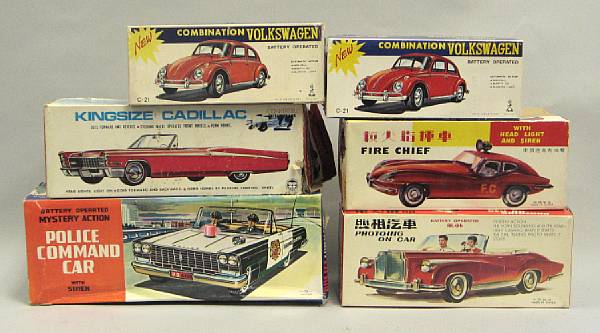 Appraisal: Battery Operated Boxed automobiles Colorful toys include a tin king