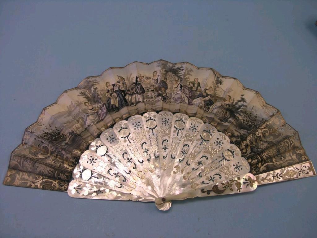 Appraisal: A th century Continental mother-of-pearl fan guards pierced and gilded