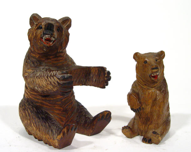 Appraisal: Two Black Forest carved wooden bears with outstretched arms largest