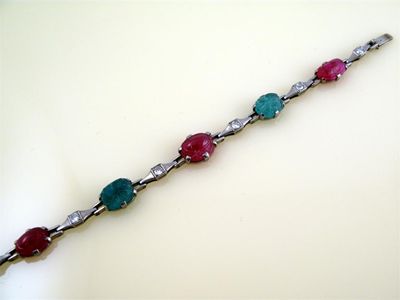 Appraisal: An Art Deco bracelet Alternately set with three carved rubies