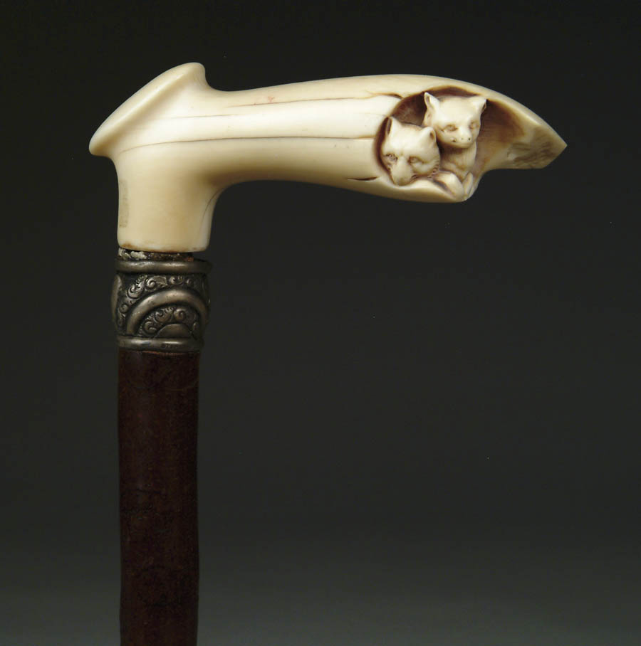 Appraisal: CARVED IVORY FOX DEN CANE Carved L-shape handle in stag