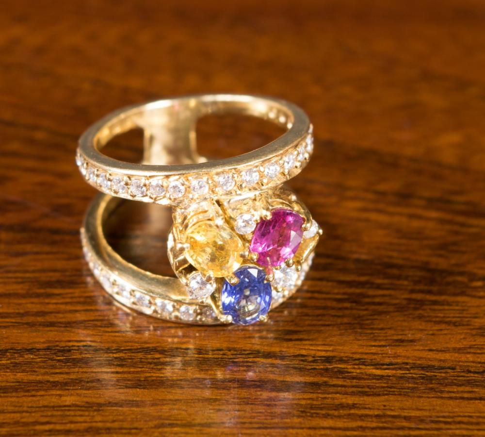 Appraisal: MULTI COLOR SAPPHIRE AND EIGHTEEN KARAT GOLD RING featuring a