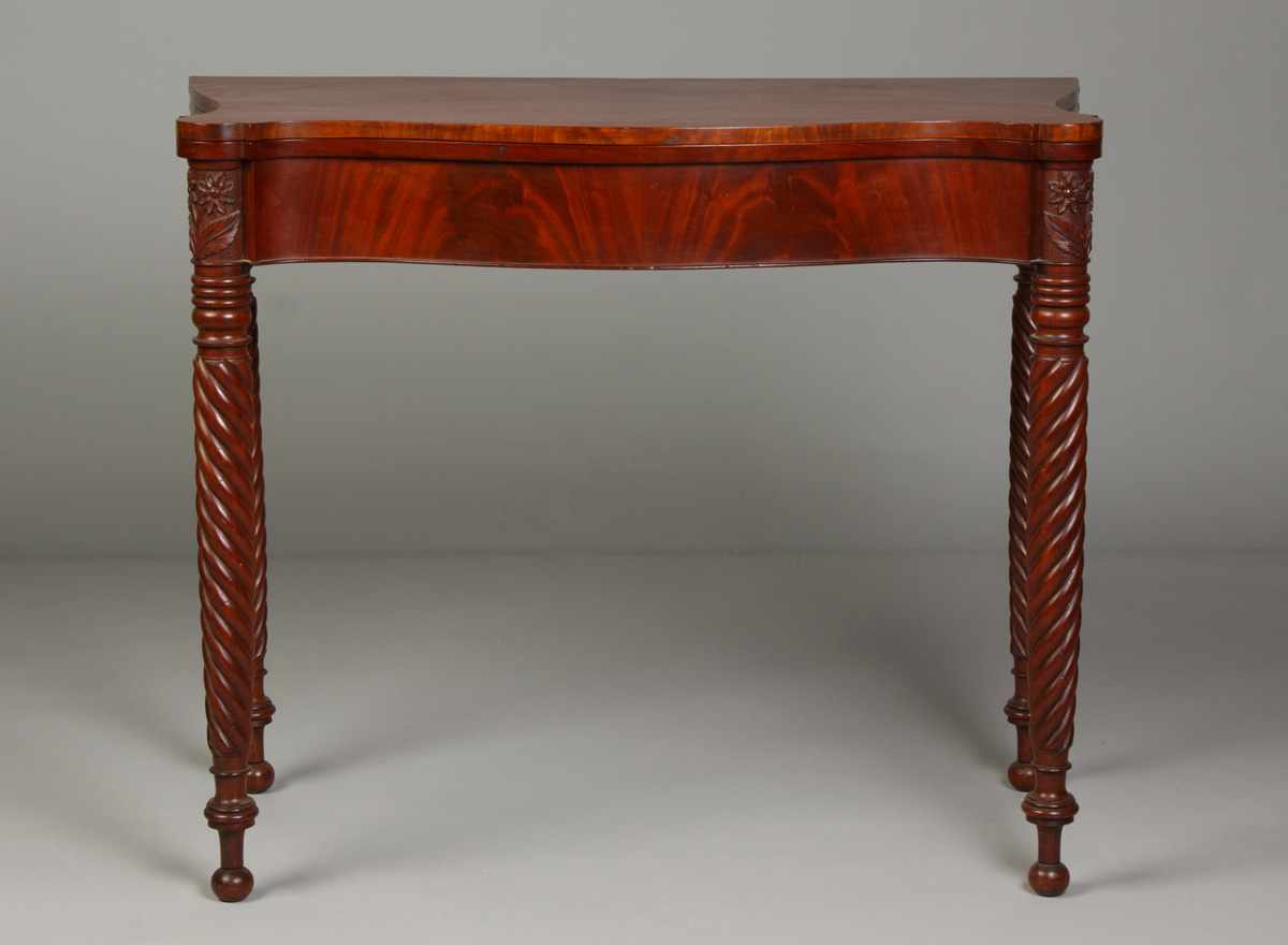 Appraisal: Massachusetts Serpentine Front Mahogany Card Table Carved floral relief flowers