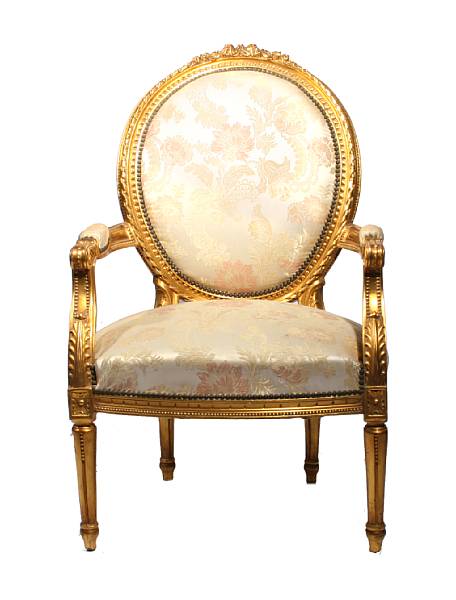 Appraisal: A pair of Louis XVI style carved and gilded fauteuils