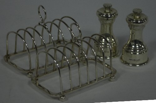 Appraisal: A pair of silver toast racks Sheffield with loop handles