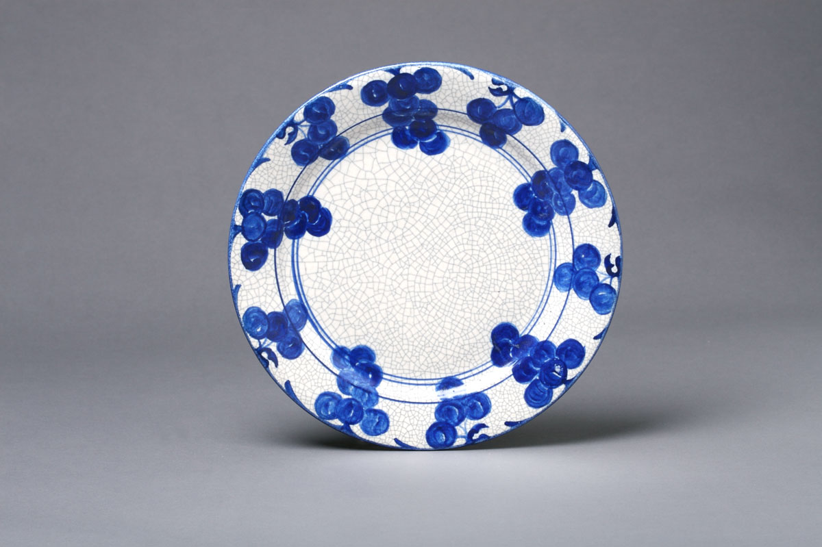 Appraisal: DEDHAM POTTERY 'GRAPE' PATTERN PLATE Painted in dark blue with