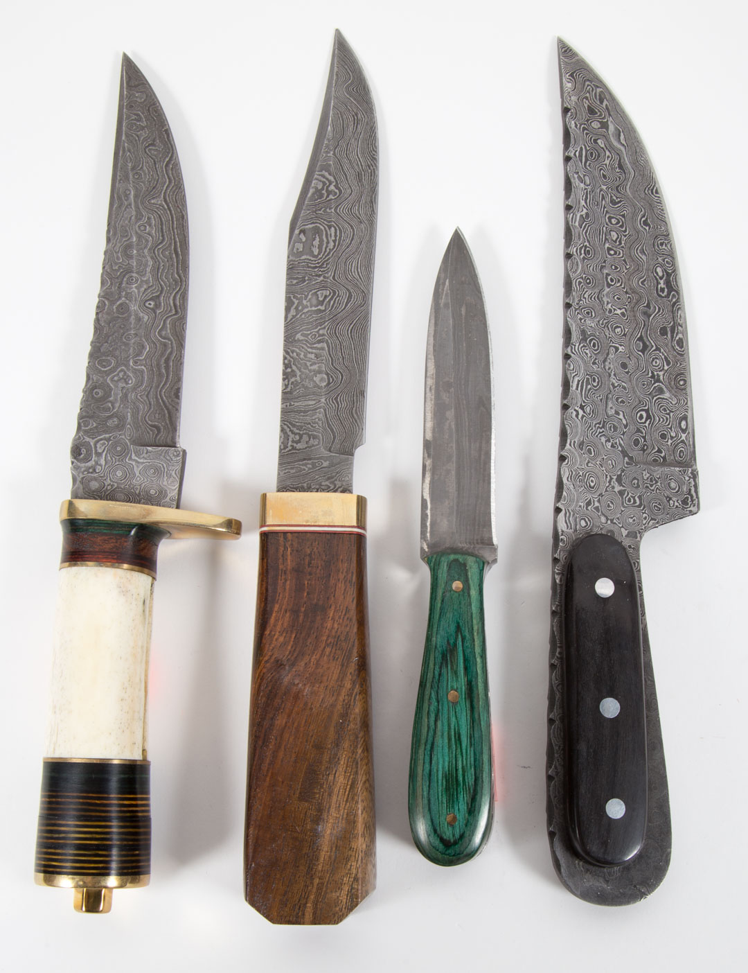 Appraisal: Custom Knives with Etched Damascus Blades Four custom knives with