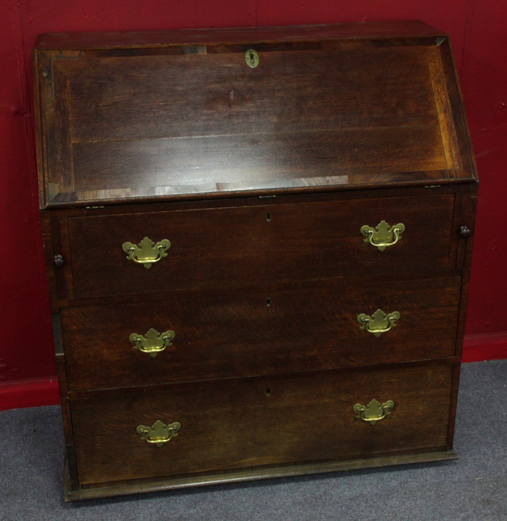 Appraisal: A th Century oak bureau with fitted interior behind a