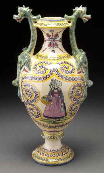 Appraisal: Henriot Quimper pottery ewer with dragon handlesand a painted scene