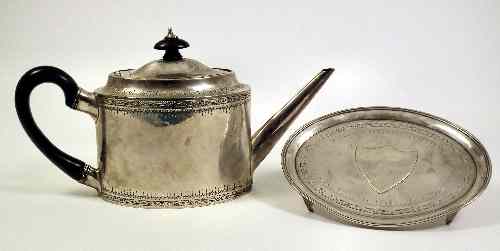 Appraisal: A George III silver oval teapot of Neo-classical design engraved