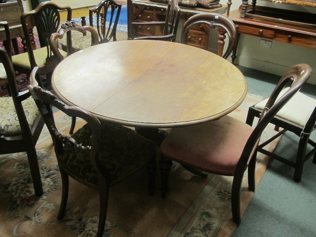 Appraisal: Victorian mahogany circular table with four assorted mahogany dining chairs