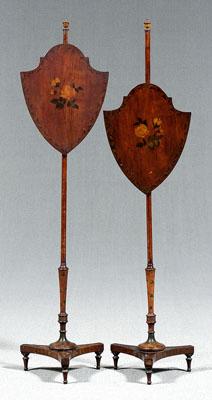 Appraisal: Pair Adam style pole screens turned finials shield form adjustable