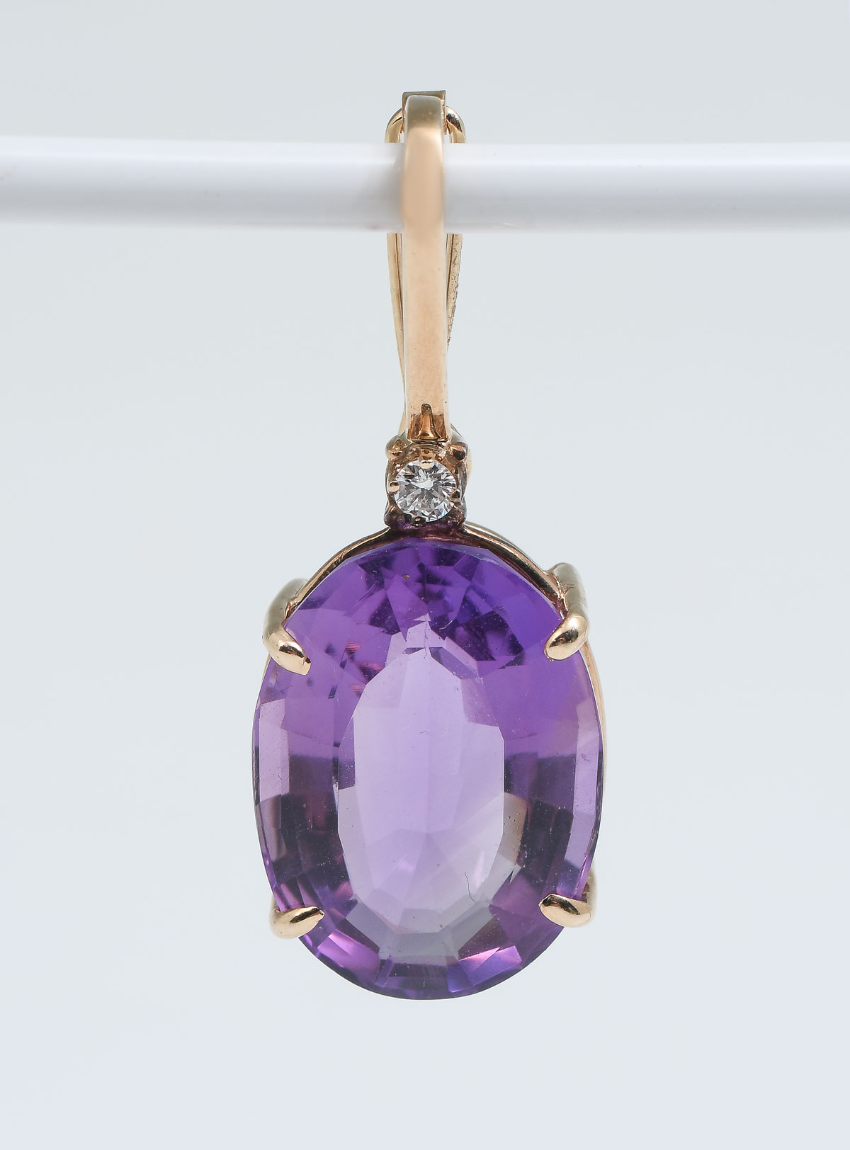 Appraisal: K OVAL AMETHYST ENHANCER WITH DIAMOND Large amethyst measuring x